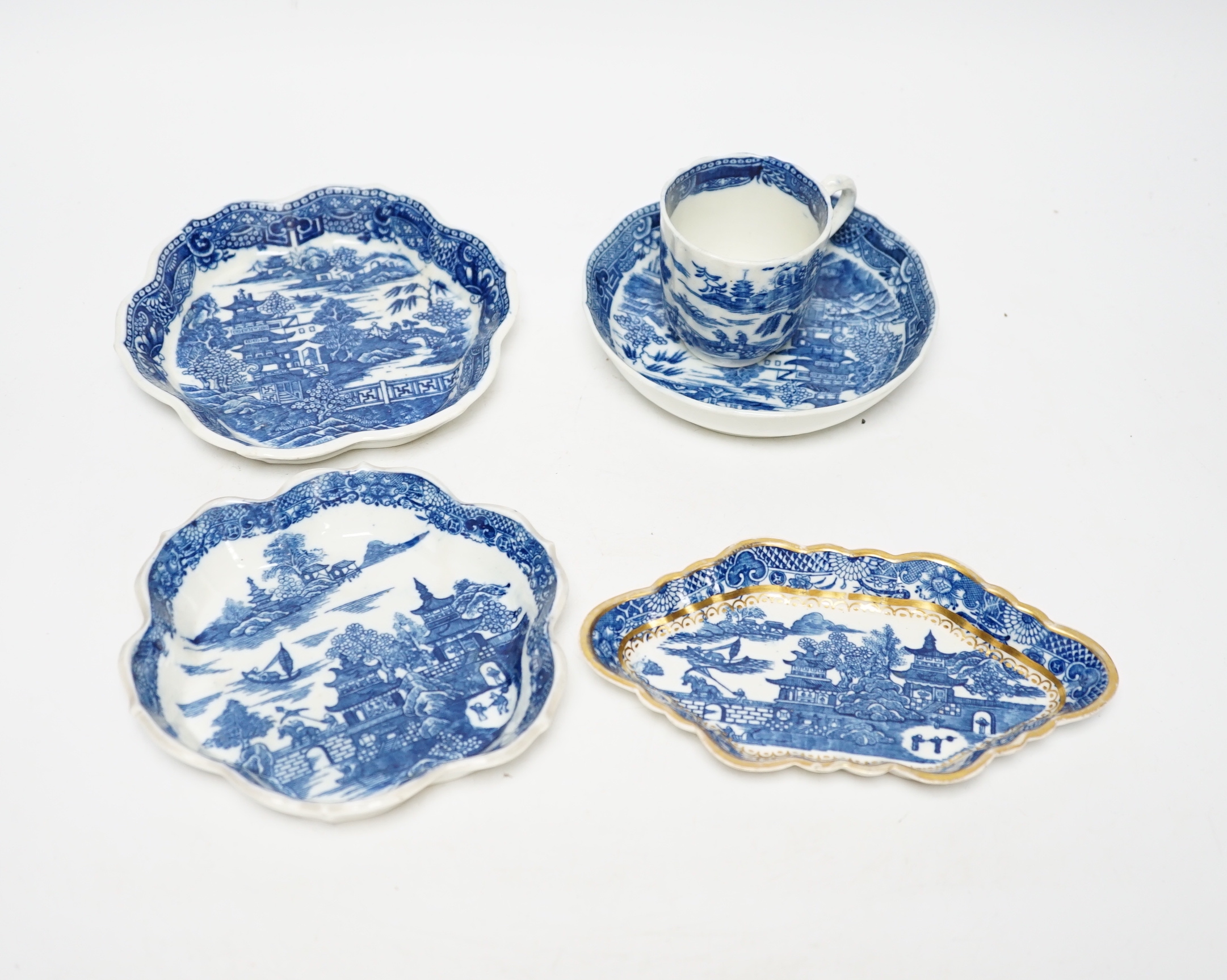 A group of Caughley pagoda pattern table wares, late 18th century, including two teapot stands, a coffee cup and saucer and a spoon tray